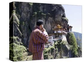 Bhutanese Man with Cell Phone, Taktshang Goemba (Tiger's Nest) Monastery, Paro, Bhutan, Asia-Angelo Cavalli-Stretched Canvas