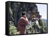 Bhutanese Man with Cell Phone, Taktshang Goemba (Tiger's Nest) Monastery, Paro, Bhutan, Asia-Angelo Cavalli-Framed Stretched Canvas