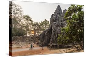 Bicycle Going Through the South Gate in Angkor Thom at Sunrise, Angkor, Siem Reap, Cambodia-Michael Nolan-Stretched Canvas