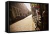 Bicycle in an Alley Street in Amsterdam, Netherlands-Carlo Acenas-Framed Stretched Canvas