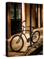 Bicycle Leaning Against Post in USA-Jody Miller-Stretched Canvas