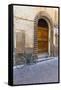 Bicycle parked outside front door, Lucca, Tuscany, Italy, Europe-John Guidi-Framed Stretched Canvas