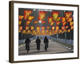 Bicycle Riders at Entranceway to Festival, Ice and Snow Festival, Harbin, Heilongjiang, China-Walter Bibikow-Framed Photographic Print