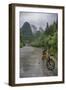 Bicycle sits in front of the Guilin Mountains, Guilin, Yangshuo, China-Josh Anon-Framed Photographic Print