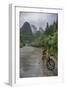 Bicycle sits in front of the Guilin Mountains, Guilin, Yangshuo, China-Josh Anon-Framed Photographic Print