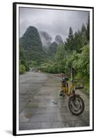 Bicycle sits in front of the Guilin Mountains, Guilin, Yangshuo, China-Josh Anon-Framed Premium Photographic Print