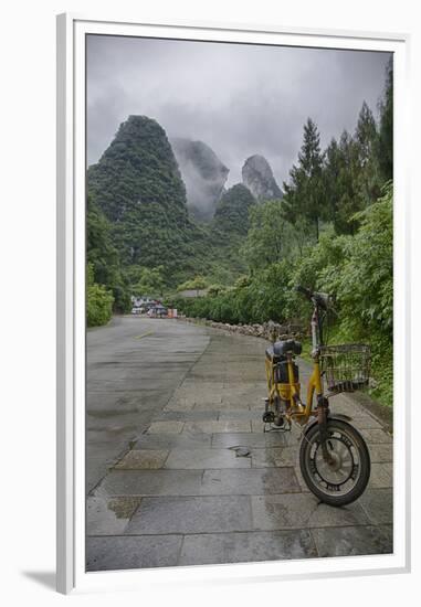 Bicycle sits in front of the Guilin Mountains, Guilin, Yangshuo, China-Josh Anon-Framed Premium Photographic Print