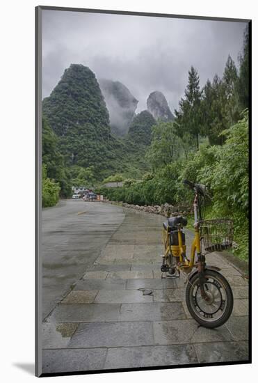 Bicycle sits in front of the Guilin Mountains, Guilin, Yangshuo, China-Josh Anon-Mounted Photographic Print