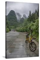 Bicycle sits in front of the Guilin Mountains, Guilin, Yangshuo, China-Josh Anon-Stretched Canvas