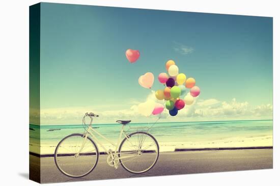 Bicycle Vintage with Heart Balloon on Beach Blue Sky Concept of Love in Summer and Wedding-jakkapan-Stretched Canvas