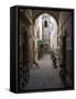 Bicycles and motorcycles parked in an alley off the Rue de la Scala, Essaouira, Morocco-null-Framed Stretched Canvas