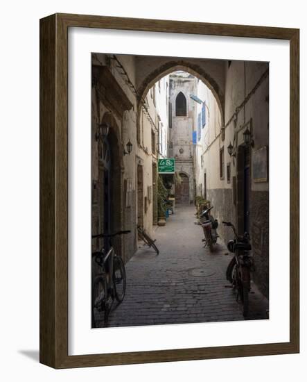 Bicycles and motorcycles parked in an alley off the Rue de la Scala, Essaouira, Morocco-null-Framed Photographic Print