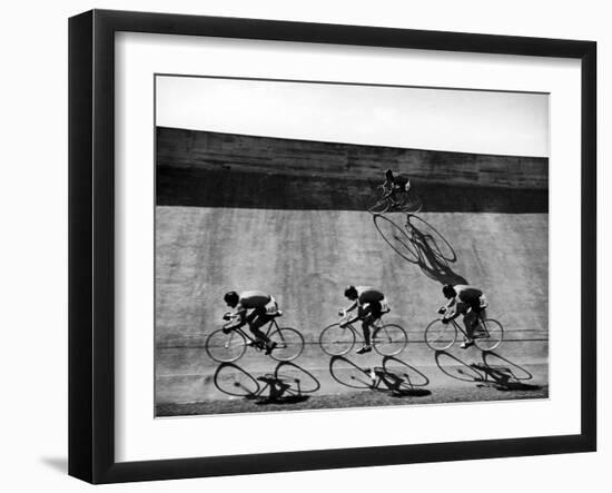 Bicycles Forming Distorted Designs on Track as Peddlers Grind Away in the 4,000 Meter Team Pursuit-Ralph Crane-Framed Photographic Print