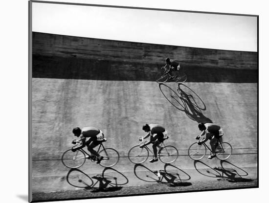 Bicycles Forming Distorted Designs on Track as Peddlers Grind Away in the 4,000 Meter Team Pursuit-Ralph Crane-Mounted Photographic Print