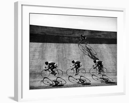 Bicycles Forming Distorted Designs on Track as Peddlers Grind Away in the 4,000 Meter Team Pursuit-Ralph Crane-Framed Photographic Print