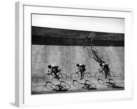 Bicycles Forming Distorted Designs on Track as Peddlers Grind Away in the 4,000 Meter Team Pursuit-Ralph Crane-Framed Photographic Print