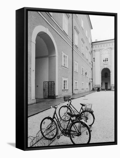 Bicycles in the Domplatz, Salzburg, Austria-Walter Bibikow-Framed Stretched Canvas