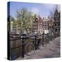 Bicycles on a Bridge Across the Canal at Herengracht in Amsterdam, Holland-Roy Rainford-Stretched Canvas