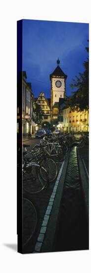 Bicycles Parked Along a Stream Near a Road, Freiburg, Baden-Wurttemberg, Germany-null-Stretched Canvas