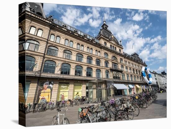 Bicycles parked in front of the Magasin du Nord department store, Copenhagen, Denmark, Scandinavia-Jean Brooks-Stretched Canvas