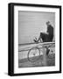 Bicyclist William Anderson Reading a Letter While Biking During a Six Day Bike Race-Ralph Morse-Framed Photographic Print