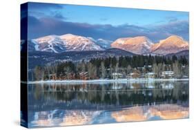 Big Mountain Reflects in Whitefish Lake, Whitefish, Montana, Usa-Chuck Haney-Stretched Canvas