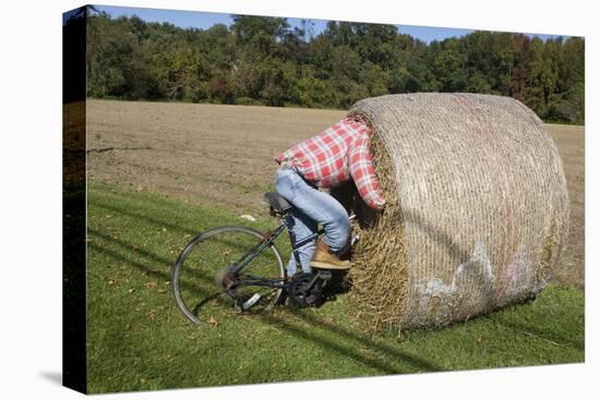 Bike Riding into Hay Bail-null-Stretched Canvas