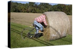 Bike Riding into Hay Bail-null-Stretched Canvas