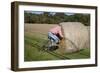 Bike Riding into Hay Bail-null-Framed Photographic Print