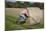 Bike Riding into Hay Bail-null-Mounted Photographic Print