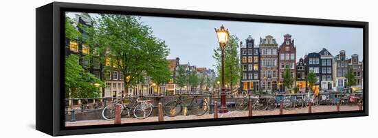 Bikes and Houses Along Canal at Dusk at Intersection of Herengracht and Brouwersgracht-null-Framed Stretched Canvas