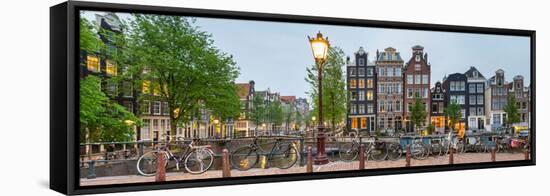 Bikes and Houses Along Canal at Dusk at Intersection of Herengracht and Brouwersgracht-null-Framed Stretched Canvas