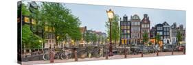 Bikes and Houses Along Canal at Dusk at Intersection of Herengracht and Brouwersgracht-null-Stretched Canvas