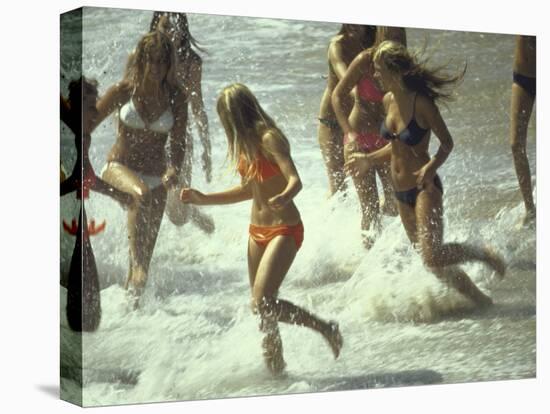 Bikini Clad Teens Frolicking in Surf at Beach-Co Rentmeester-Stretched Canvas