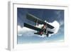 Biplane Flying in Blue Cloudy Sky-Stocktrek Images-Framed Art Print