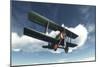 Biplane Flying in Blue Cloudy Sky-Stocktrek Images-Mounted Art Print
