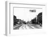 Biplane over a Small Town-J.H. Cave-Framed Photographic Print