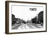 Biplane over a Small Town-J.H. Cave-Framed Photographic Print