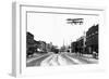 Biplane over a Small Town-J.H. Cave-Framed Photographic Print