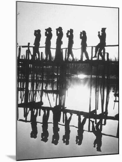 Bird Counters of the Audubon Society Standing on a Bridge-Francis Miller-Mounted Photographic Print