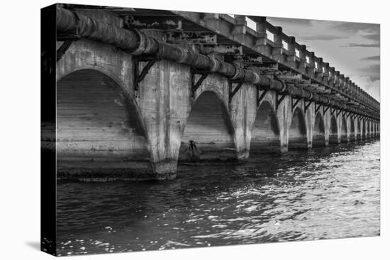 Black and White Horizontal Image of an Old Arch Bridge in Near Ramrod Key, Florida-James White-Stretched Canvas