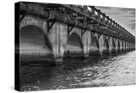 Black and White Horizontal Image of an Old Arch Bridge in Near Ramrod Key, Florida-James White-Stretched Canvas