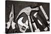 Black and White Image of a Set of Tools on a Textured Metallic Background-Kamira-Stretched Canvas