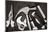 Black and White Image of a Set of Tools on a Textured Metallic Background-Kamira-Mounted Photographic Print