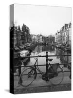 Black and White Image of an Old Bicycle by the Singel Canal, Amsterdam, Netherlands, Europe-Amanda Hall-Stretched Canvas