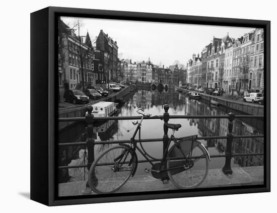 Black and White Imge of an Old Bicycle by the Singel Canal, Amsterdam, Netherlands, Europe-Amanda Hall-Framed Stretched Canvas