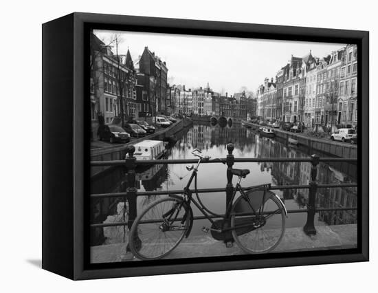 Black and White Imge of an Old Bicycle by the Singel Canal, Amsterdam, Netherlands, Europe-Amanda Hall-Framed Stretched Canvas