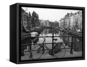 Black and White Imge of an Old Bicycle by the Singel Canal, Amsterdam, Netherlands, Europe-Amanda Hall-Framed Stretched Canvas