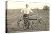 Black and White Photo of Man with Vintage Motorcycle-null-Stretched Canvas