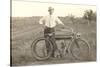 Black and White Photo of Man with Vintage Motorcycle-null-Stretched Canvas
